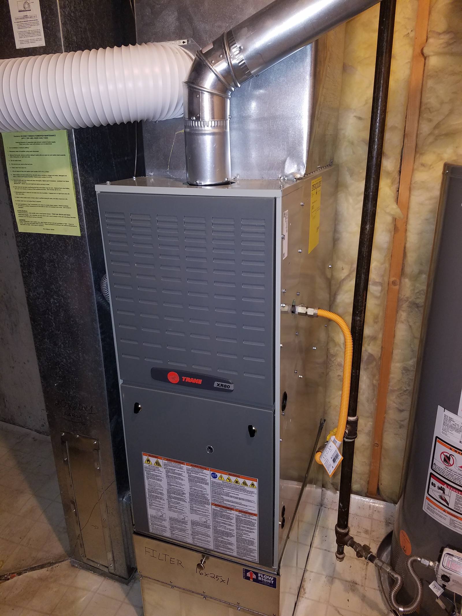 Furnace replacement: Trane furnace install with new venting and gas line beside a water heater